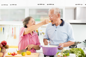 Older couple cooking together