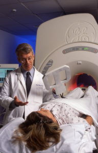 Dr. Hugh Calkins talks to his patient about what to expect during the scan.