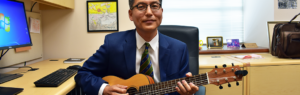 Dr. Wu playing guitar