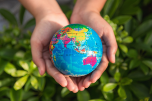 hands holding a globe