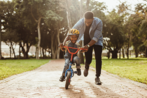 boy learning to bike