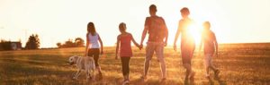family walking in the countryside