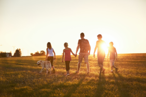 family walking in the countryside