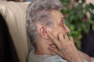 old woman with hearing aid