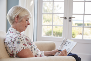 Woman doing crossword puzzle
