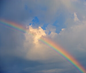 rainbow against the background of clouds. Spring season.