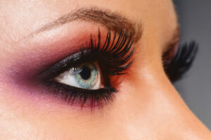 Close up woman eye with beautiful shades smokey eyes makeup. Modern fashion make up.