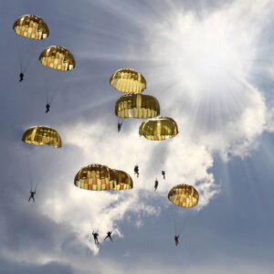 skydivers on stormy sky.