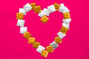 Large amount of condoms, shot from above - safe sex and contraception concept