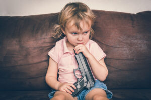 Child playing with a parent's gun that wasn't safely stored.