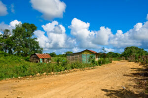 Road in the village under blue sky