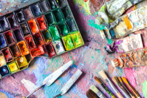 oil paints and paint brushes on a palette