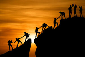 Group of people on peak mountain climbing helping team work , travel trekking success business concept