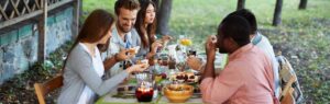 family eating meal outside