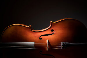 Silhouette of a Cello on black background