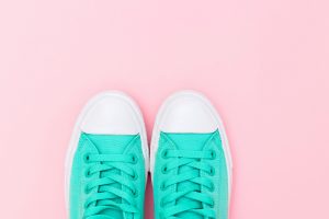 Mint sneakers on pink background