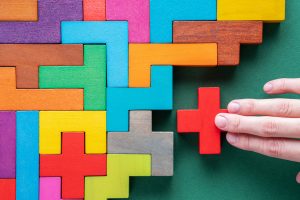 Top view on colorful wooden blocks. Concept of decision making process, logical thinking. Logical tasks