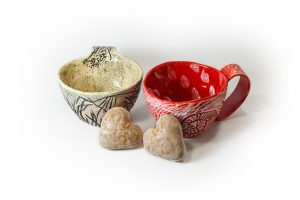 two clay teacups
