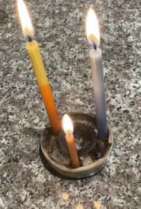 Our makeshift menorah (ours are in storage somewhere). #Grateful for family, old and new friends, and colleagues. As long as we’re alive change is a constant and hope for better times endures .