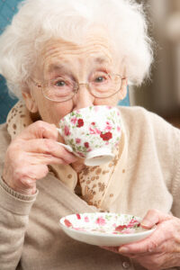 Portrait Of Senior Woman Enjoying Cup Of Tea At Home