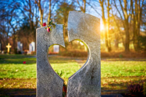 Tombstone with heart on graveyard