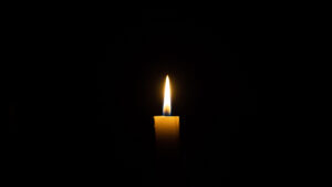 candle burning in darkness