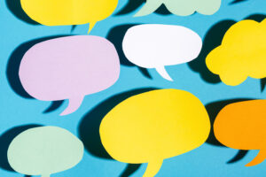 Speech bubble text message theme with hard shadow on a blue background