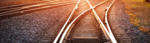 Railway track in the evening in sunset. Panoramic view on the railroad switch.