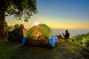 woman traveller camping in campsite with freshly morning action