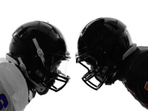two american football players facing eachother silhouette