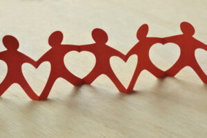 Paper people chain with hearts