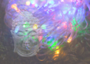 Buddha head on colourful psychedelic light background copy space