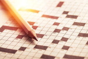 Crossword puzzle and pencil