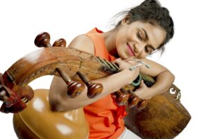 woman playing Indian instrument