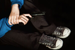 teen holding gun