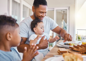 Shot of a young family having lunch together at home