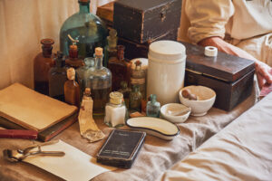 An old military field hospital with retro tents and vintage medical beds from the First World War. Mobile clinic for the treatment of soldiers of the early twentieth century
