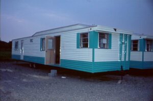 New York State, USA, 1964. American residential trailers in a parking lot.