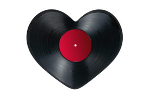 Vinyl record in shape of heart on white background, isolated