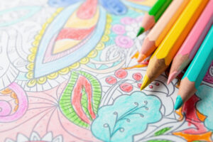 right colored pencils lie on a detailed mandala drawing coloring pages