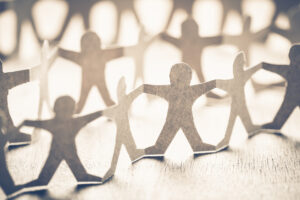 Closeup one of human chain paper, unique person in crowd concept