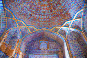 Beautiful traditional ceiling, mosaic of golden, blue and orange colors in Shah Jahan Mosque in Thatta, Pakistan. Also known as Jamia Masjid of Thatta.