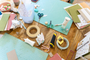 Scrapbook workshop. Cutting table with all types of scissors and adhesives