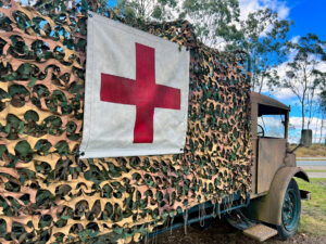 Brisbane - Sep 15 2023:International Red Cross sign on old military vehicle.Two of ICRC responsibilities is to supervise the treatment of prisoners of war and help missing persons in an armed conflict