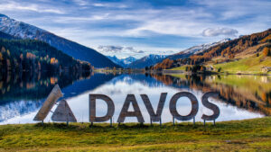 Davos. Mountain Lake Serenity, Peaceful Alpine Reflecting Snow Peaks, Calm Alpine Water Mirror Showcasing Snowy Mountain Silhouettes And Clear Skies